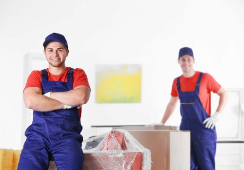 Local removal workers handling office equipment during a Tooting relocation