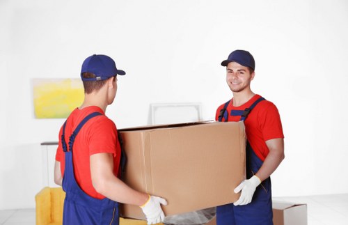 Office removals team preparing business equipment for relocation in Tooting