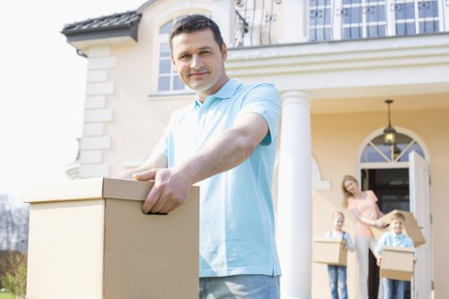 Flexible man with van moving boxes and household items