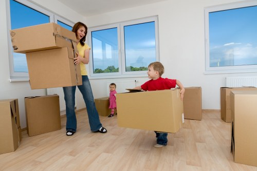 Local office movers transporting desks and furniture during a Tooting relocation