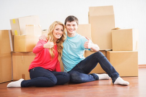 Careful loading of furniture and boxes into a moving truck in Tooting