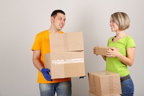 Professional removals team handling furniture during a Tooting house move